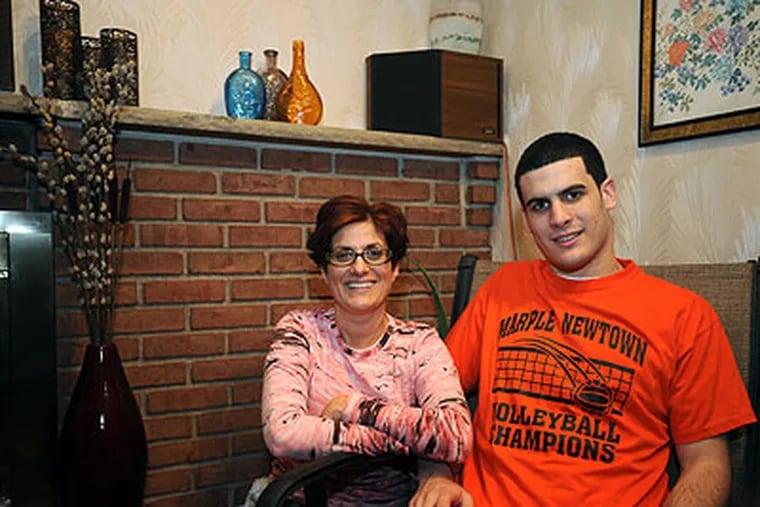 Stephen DeMaria, 18, a student at Marple Newtown High School, has to pay a fee in order to play sports at the school. His mother, Mariann DeMaria, who is president of the school's Football Booster Club, thinks this is unfair. (Sharon Gekoski-Kimmel / Staff Photographer)