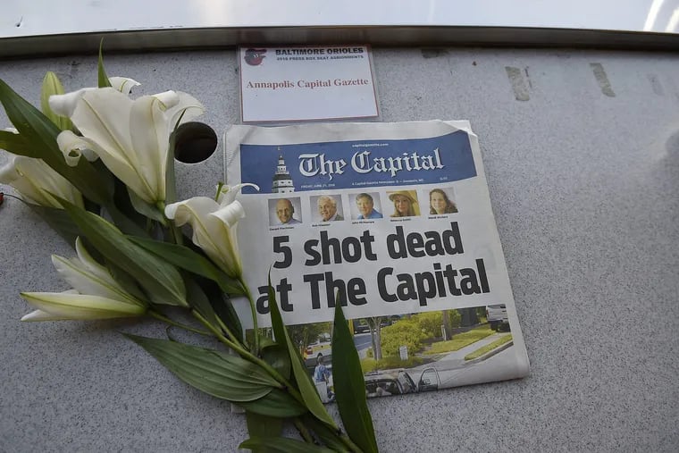 A memorial for the Capital Gazette's John McNamara is displayed at a seat in the Orioles' press box on June 29. McNamara, a longtime sportswriter at the Annapolis paper, was among five killed in a shooting at the newspaper office on June 28.