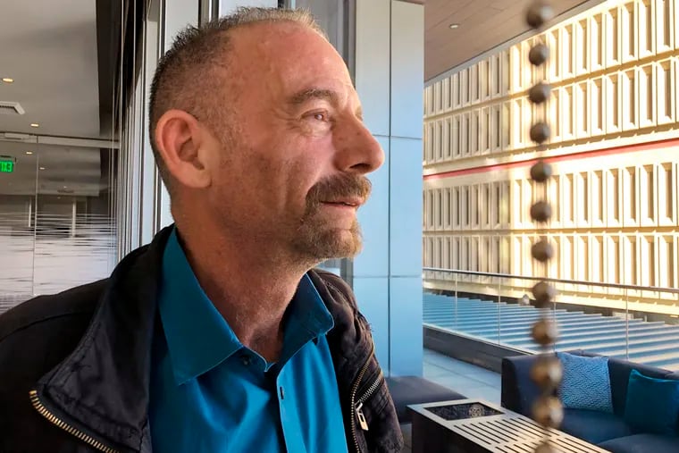 Timothy Ray Brown poses for a photograph, Monday, March 4, 2019, in Seattle. Brown, also known as the "Berlin patient," was the first person to be cured of HIV infection, more than a decade ago. Now researchers are reporting a second patient has lived 18 months after stopping HIV treatment without sign of the virus following a stem-cell transplant. But such transplants are dangerous, cannot be used widely, and have failed in other patients.