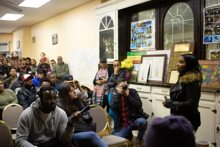 Nazareth Teklesenbet stands up and speaks about her knowledge of Kaleb Belay to a crowd at Ethiopian Community Center in West Philadelphia on 4400 Chestnut St. Philadelphia, PA, Sunday, March 10, 2019. Simon Haileab, Belay's attorney, wanted to inform media and community members about Belay as a person, the police cooperation in the case, and Belay's physical health.