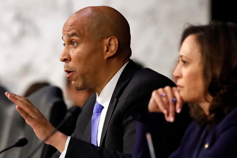 Sen. Cory Booker, D-N.J., left, next to Sen. Kamala Harris, D-Calif., questions President Donald Trump's Supreme Court nominee, Brett Kavanaugh, as he testifies before the Senate Judiciary Committee on Capitol Hill in Washington, Wednesday, Sept. 5, 2018, on the second day of his confirmation hearing to replace retired Justice Anthony Kennedy.