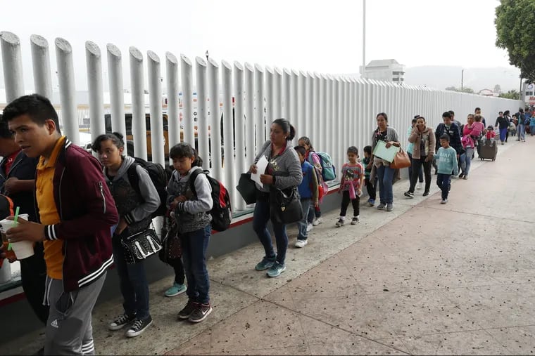 People lining up to cross into the United States to begin the process of applying for asylum near the San Ysidro port of entry in Tijuana, Mexico.