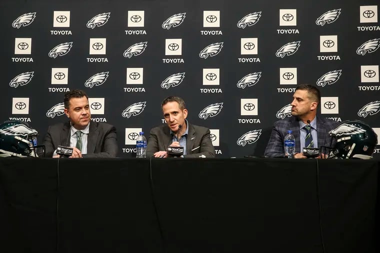 Eagles VP Andy Weidl (left), executive VP and general manager Howie Roseman (center), and head coach Nick Sirianni talking on draft night.