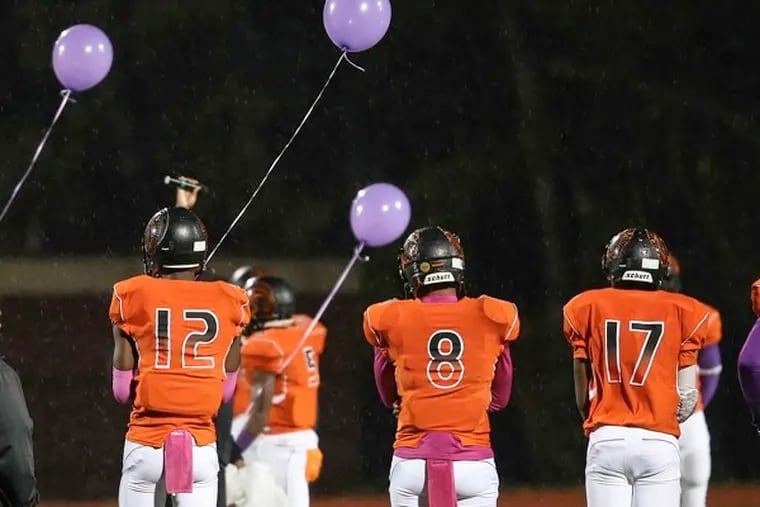 Del-Val vs. Strawberry Mansion at half time the game is dedicated with purple balloons to Aisha Abdur Rahman, the Del-Val student killed in a shooting last year. Teammates Thursday, October 1, 2015.