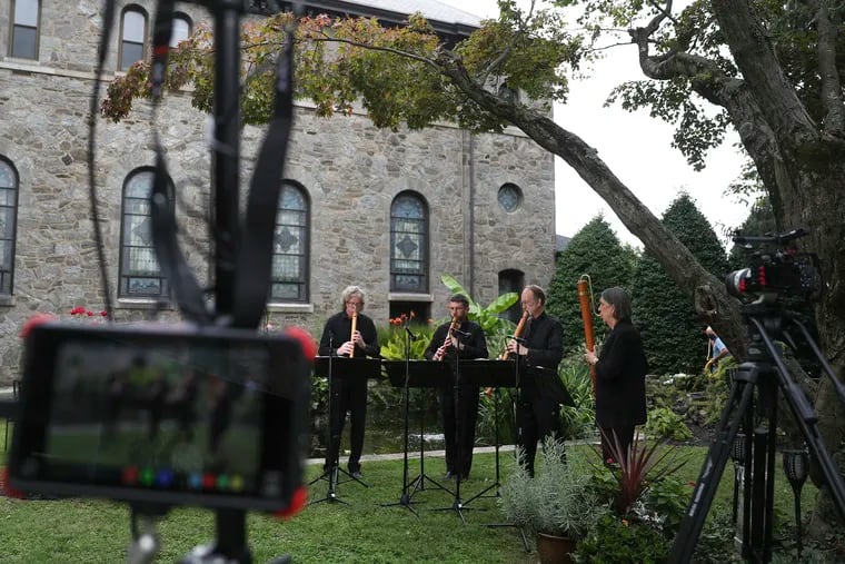 Members of Piffaro The Renaissance Band rehearse and perform a program from their all-virtual season in the courtyard of the Miraculous Medal Shrine in the Germantown section of Philadelphia on Thursday, Sept. 24, 2020.