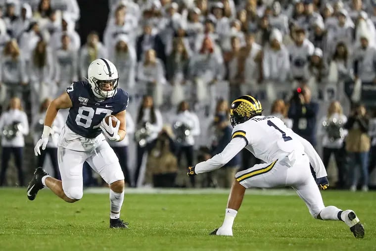 Penn State tight end Pat Freiermuth, shown after catching a pass in last year's game against Michigan, has announced he is staying with the Nittany Lions for the new 2020 football season.