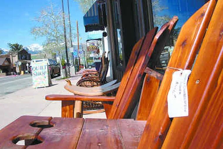 Handcrafted chairs are for sale outside Yoder's Mountain View Furniture on Main Streetin Westcliffe, Colo. Townsfolk say they are happy to have new Amish neighbors.