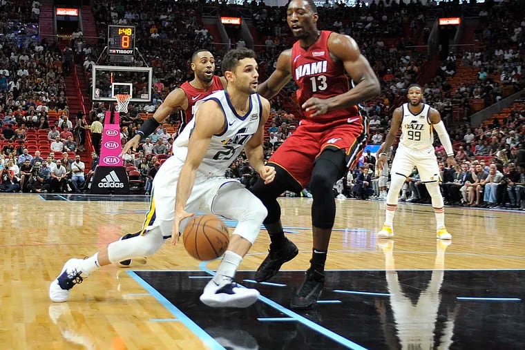 Utah Jazz guard Raul Neto drives to the basket past Miami's Bam Adebayo in 2018.