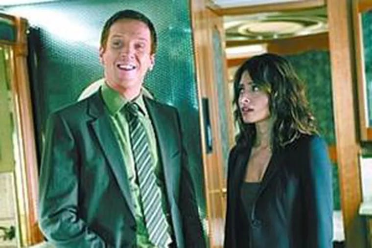 Damian Lewis (left) and Sarah Shahi star in &quot;Life.&quot;