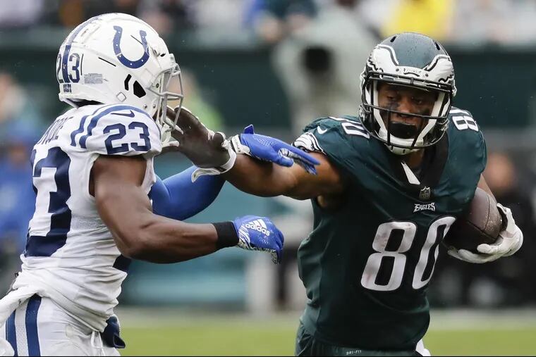Eagles wide receiver Jordan Matthews runs with the football while stiff arming Indianapolis Colts cornerback Kenny Moore during the fourth-quarter on Sunday, September 23, 2018 in Philadelphia. YONG KIM / Staff Photographer