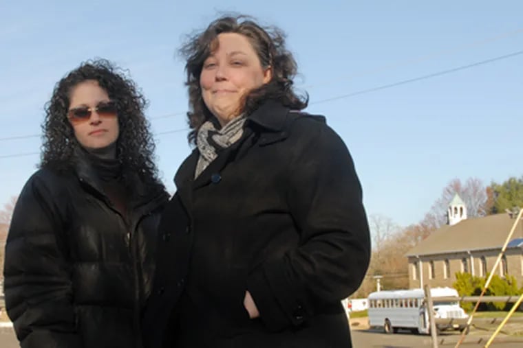Kim Simmons-Dimpter and Rita McClellan (right) worry that rehab services at Solid Rock Worship Center, behind them, could jeopardize the community. (Tom Gralish / Staff Photographer)