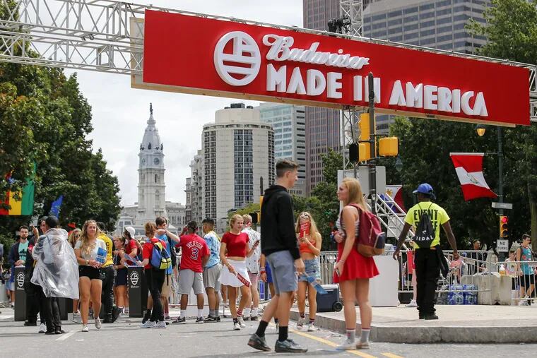 Fans arrive to the Made In America festival along the Benjamin Franklin Parkway on Sunday, September 3, 2017.