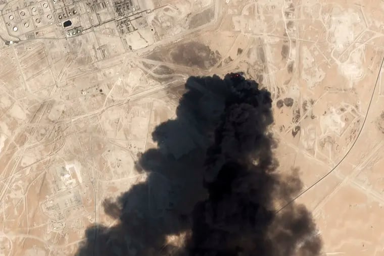 This satellite image from Planet Labs Inc., taken on Sept. 24, 2019, shows thick black smoke rising from Saudi Aramco's Abqaiq oil processing facility in Buqyaq, Saudi Arabia.