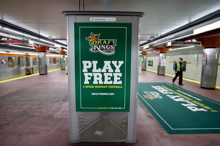DraftKings, touted here at SEPTA’s AT&T Station, is one of two big players in the fantasy sports business.