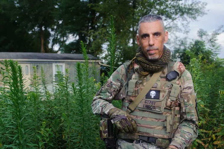 Christian Yingling stands for a portrait in his militia uniform on Monday, Aug. 14, 2017, in his neighborhood in Derry. Yingling is the leader of the Pennsylvania Lightfoot Militia, based out of Latrobe.