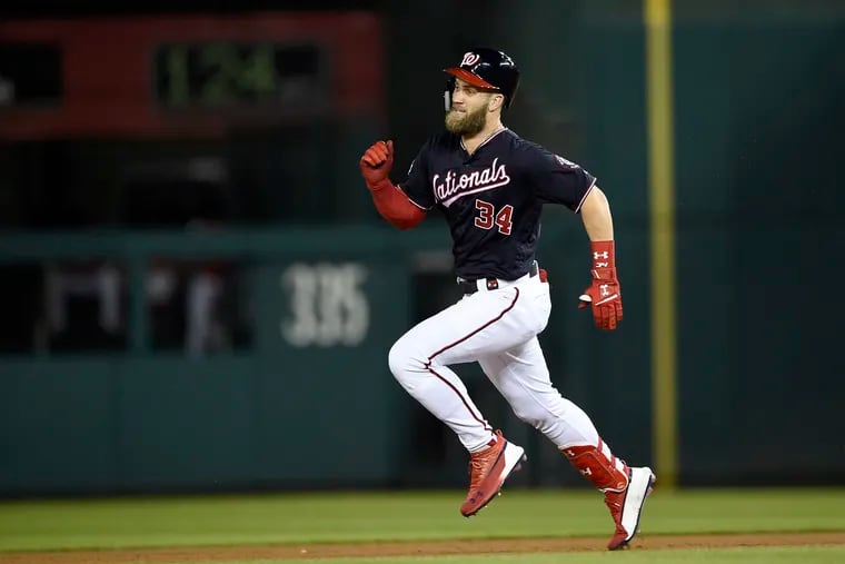 Washington Nationals' Bryce Harper runs toward second on his double during the third inning of a baseball game against the Miami Marlins, Tuesday, Sept. 25, 2018, in Washington. (AP Photo/Nick Wass)