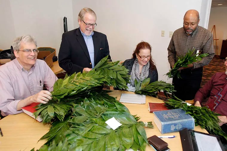 With Eco-Palms are (from left) the Rev. David Tatgenhorst of St. Luke United Methodist Church, the Rev. James McIntire of Hope United Methodist Church, the Rev. Lydia Munoz of Plumbline United Methodist Church, the Rev. Steven Lawrence of White Rock Baptist Church, the Rev. Hal Taussig of Chestnut Hill United Church.
