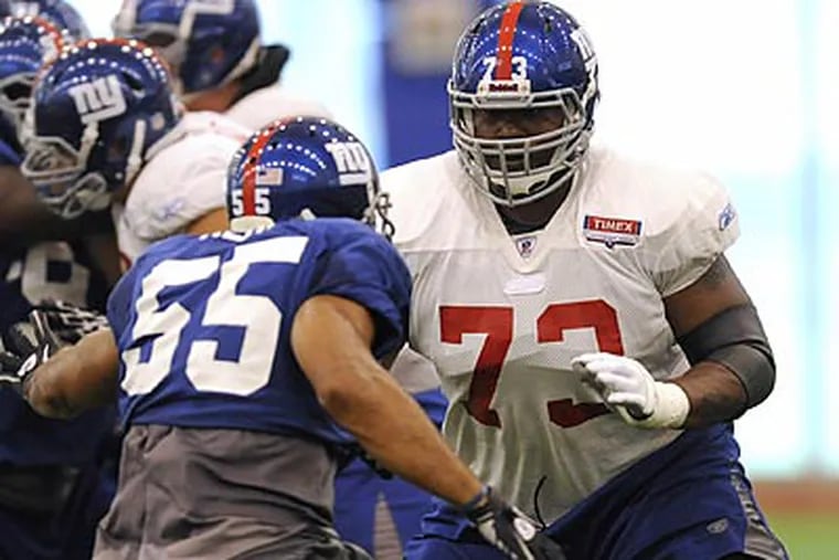 Shawn Andrews is trying to continue his career with the Giants. (AP Photo / Bill Kostroun)