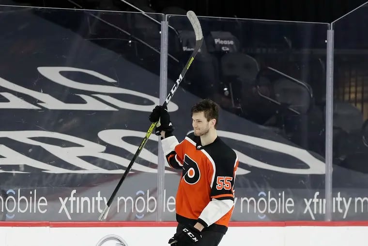 Flyers defenseman Samuel Morin raises his stick after being named the game's No. 1 star following the Flyers' 2-1 win Saturday over the Rangers. Morin won the game with his first NHL goal, which was scored late in the third period.