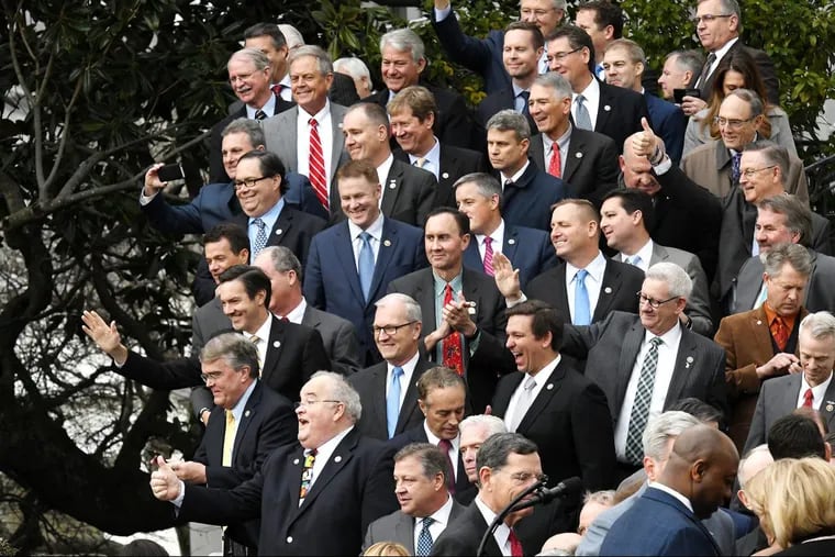 Republicans wave to President Trump at an event last week on the South Lawn of the White House celebrating Congress’ passage of the Tax Cuts and Jobs Act.