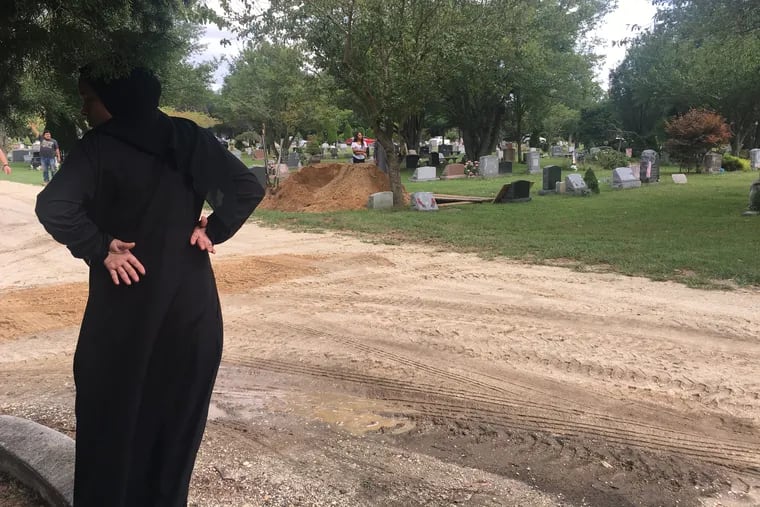 Natasha Stackhouse, 28, looks toward the grave of Qa'Id Muhammad at Seaside Cemetery in Cape May County Wednesday morning.