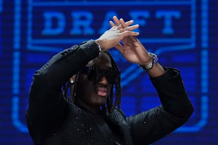Ohio State wide receiver Marvin Harrison Jr. walks on stage before the first round of the NFL football draft, Thursday, April 25, 2024, in Detroit. (AP Photo/Jeff Roberson)