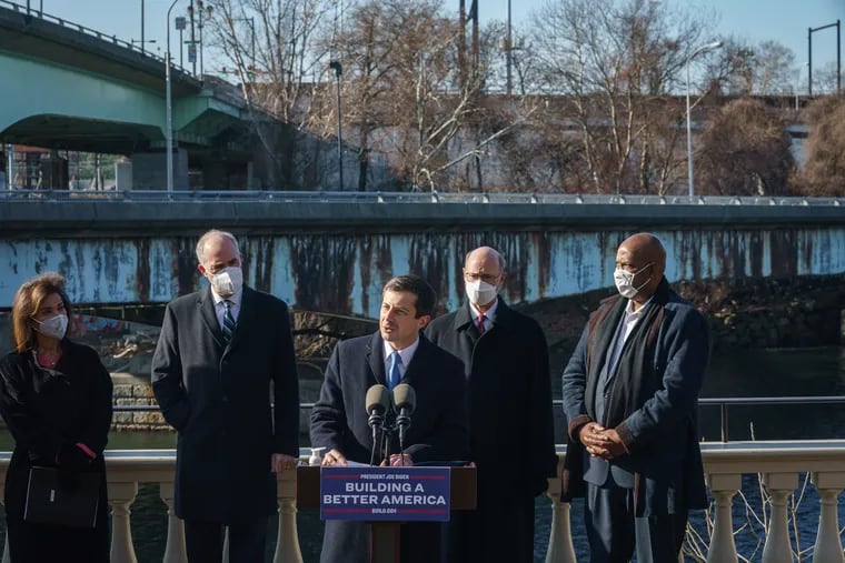 U.S. Secretary of Transportation Pete Buttigieg speaks at a press conference in front of the Martin Luther King Jr. Bridge in Philadelphia in January 2022.