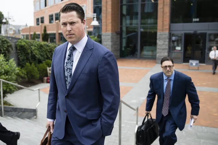Defense lawyers Paul Lang, left, and Michael Parlow walk from the Bucks County Courthouse in Doylestown. Lang, a defense attorney for Cosmo DiNardo, said Thursday that his client has admitted killing the four men who went missing last week and told authorities the location of the bodies. Lang says prosecutors agreed to take the death penalty off the table in return for DiNardo’s cooperation.