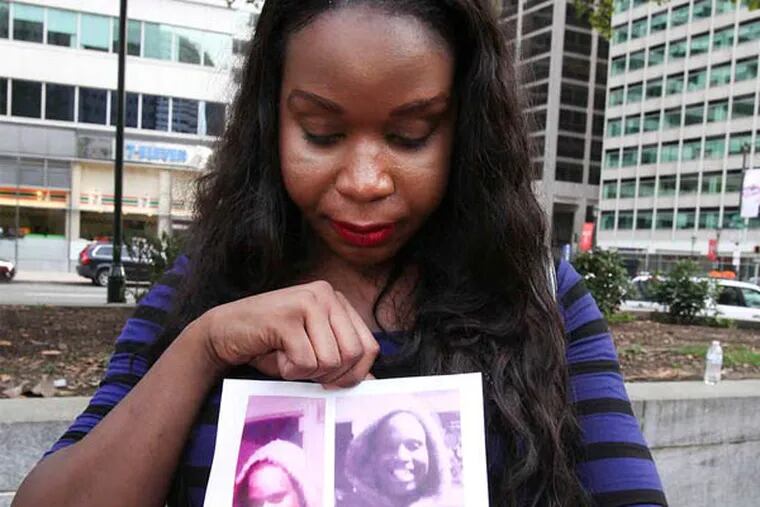 STEVEN M. FALK / STAFF PHOTOGRAPHER Aamina Morrison with a photo of her friend Diamond, a transgender woman slain in July.