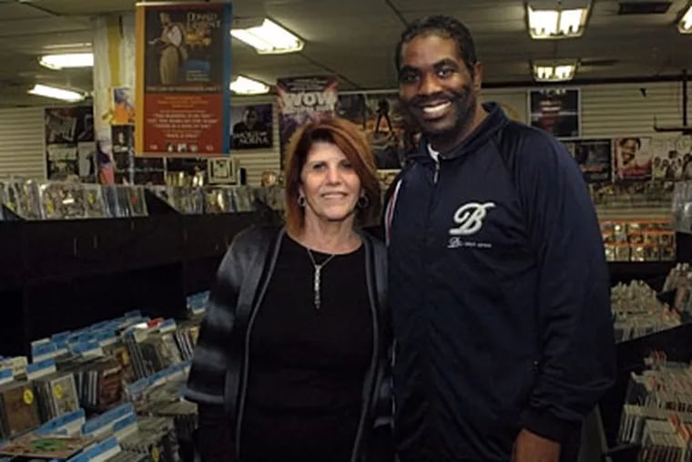 Record Store Day is tomorrow. The Sound of Market in Center City is one of the few such stores left. Ravka Vaturi, left, is owner and her Darryl King, right, is manager. (Tiffany Yoon / Staff Photographer)