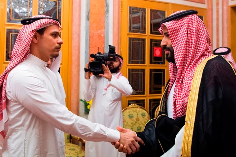 In this photo released by the Saudi Press Agency, Saudi Crown Prince Mohammed bin Salman, right, shakes hands with Salah Khashoggi, a son of Jamal Khashoggi, in Riyadh, Saudi Arabia, on Oct. 23, 2018. The meeting came just days after Saudi Arabia acknowledged that Jamal Khashoggi was killed at the Saudi consulate in Istanbul, Turkey, in what they claimed was a "fistfight." (Saudi Press Agency via AP)