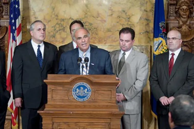 Gov. Ed Rendell is flanked by a bipartisan group of lawmakers as he announces a budget agreement on Sept.18. The deal has since disintegrated. (AP Photo/John C. Whitehead)