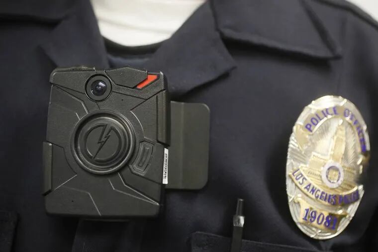 This Jan. 15, 2014 file photo shows a Los Angeles police officer wearing an on-body camera during a demonstration for media in Los Angeles. Thousands of police agencies have equipped officers with cameras to wear with their uniforms, but theyâ€™ve frequently lagged in setting policies on how theyâ€™re used, potentially putting privacy at risk and increasing their liability. (AP Photo/Damian Dovarganes)
