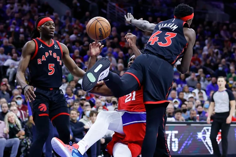 Sixers center Joel Embiid gets fouled by Toronto Raptors forward Pascal Siakam in the first quarter during Game 2.