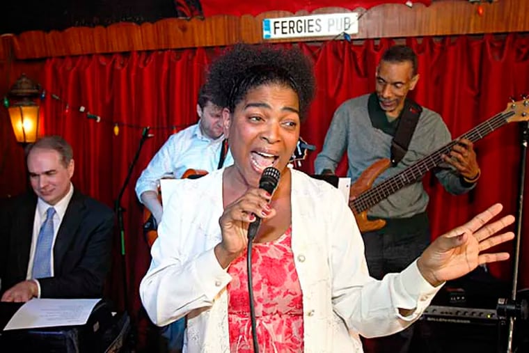 Rhenda Fearrington sings backed up by keyboard player Jim Holton (left) and bass player Mike Boone at Fergie's Pub. ( AKIRA SUWA  /  Staff Photographer )