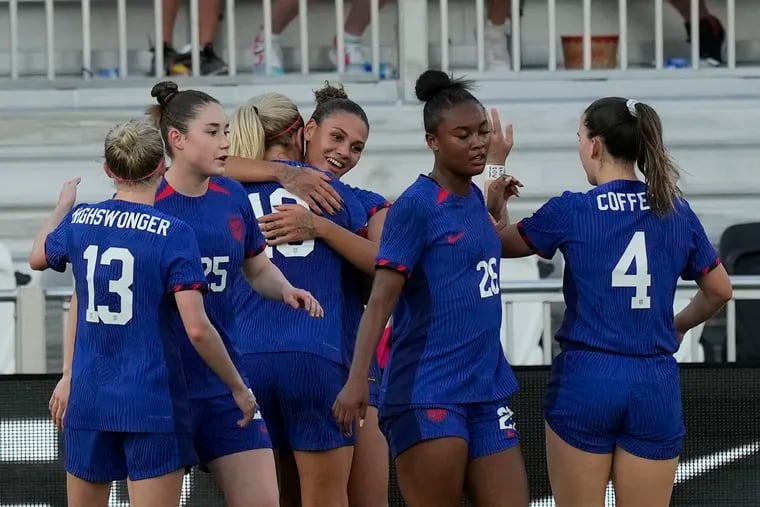 Trinity Rodman (center) celebrates after scoring for the United States against China.