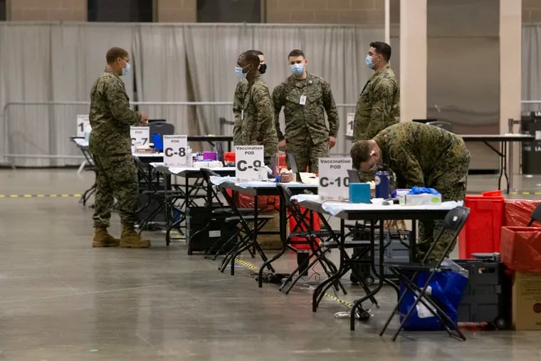 Military personnel with FEMA's vaccine site at Pennsylvania Convention Center on Tuesday, March 2, 2021.