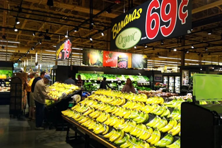 Wegmans Shoppers are greeted at the KOP location's entrance by displays of organic strawberries and bananas (above).