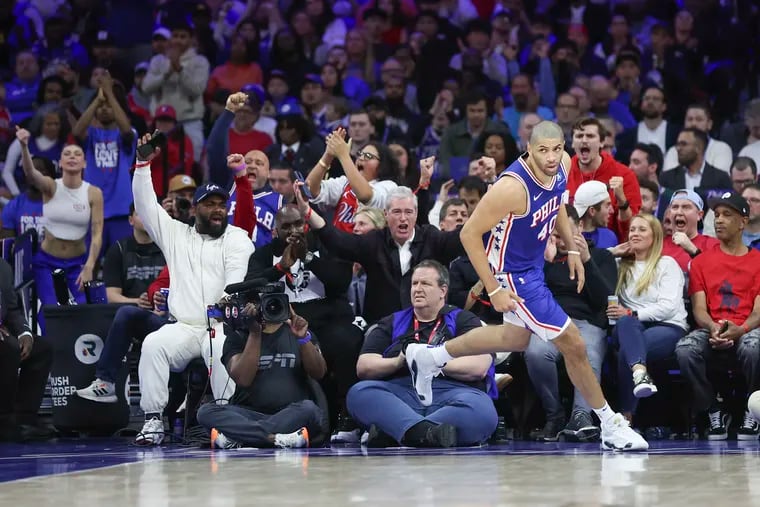The crowd, including Eagles’ defensive end Brandon Graham, cheer on after Sixers forward Nicolas Batum scored in the fourth quarter of their NBA Play-In Tournament win over the Miami Heat at the Wells Fargo Center,