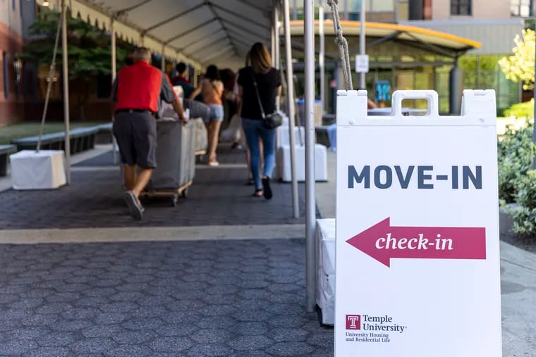 Students begin moving into the dorms at Temple University on Thursday.