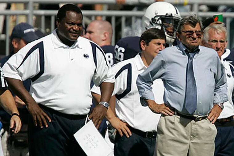 Jamil Pollard praised Penn State assistant coach Larry Johnson (left), but decommitted anyway. (Carolyn Kaster/AP file photo)