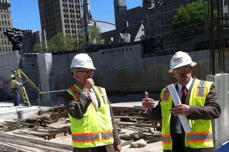 Paul Levy, president of the Center City District, and Steve Bussey, its vice president, at Dilworth Plaza, in front of what will be a cafe. (Paul Nussbaum / Staff)
