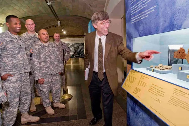 C. Brian Rose, deputy director of Penn's Museum of Archaeology and Anthropology, talks with soldiers from the 352d Civil Affairs and Communications outfit about ancient Sumerian tablets.