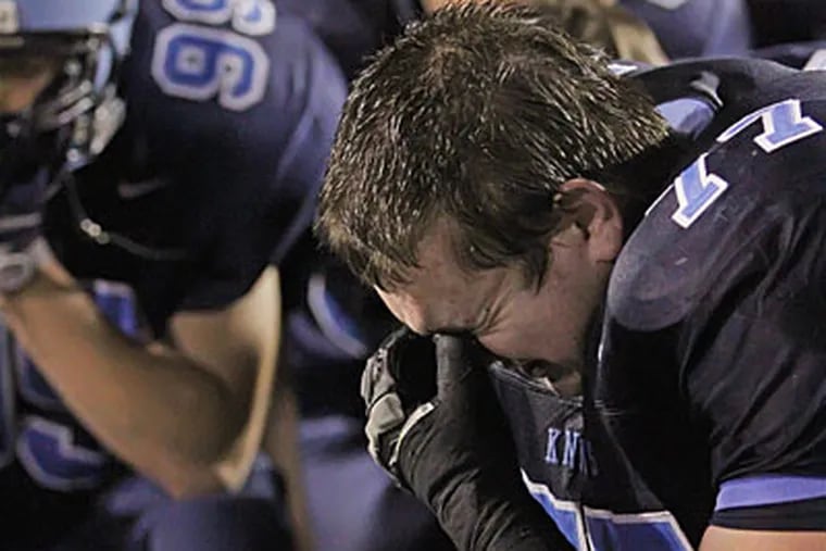 TJ Smink can't hold back the tears after North Penn lost to Central Dauphin, 14-7. (Michael Bryant / Staff Photographer)