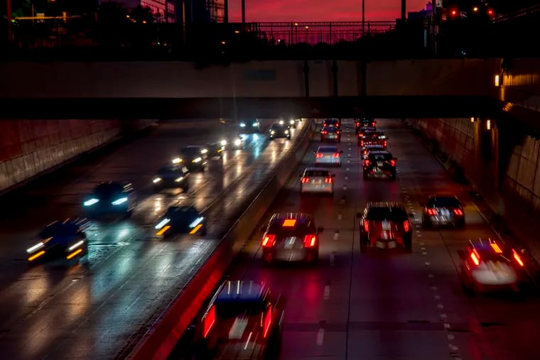 Traffic moves along I-676, the Vine Street Expressway as the the sun sets. Groups of drivers who have a greater chance of getting into car crashes are likely behind the wheel of vehicles that aren’t as safe, according to a new CHOP study.