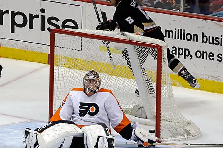 Ducks right winger Teemu Selanne (8), of Finland, celebrates a goal on Philadelphia Flyers goalie Steve Mason by left winger Patrick Maroon, not seen, during the first period of an NHL hockey game in Anaheim, Calif., Thursday, Jan. 30, 2014. (AP Photo)