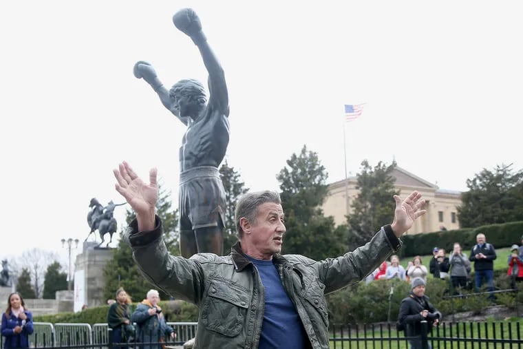 Actor Sylvester Stallone waves to fans while visiting the Rocky statue outside the Philadelphia Museum of Art on Friday, April 6, 2018. Stallone, who is in town filming Creed 2, visited the statue to dedicate a new plaque at its base.