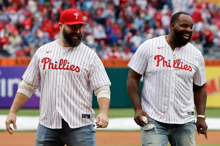 Retired Eagles center Jason Kelce (left) and defensive tackle Fletcher Cox after they threw the ceremonial first pitch before the Phillies played the Braves on opening day on March 30.