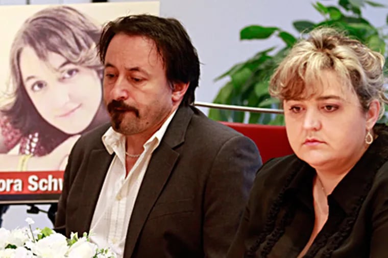 The parents of victim Dora Schwendtner, Peter Schwendtner and Aniko Takacs, participate Sunday in a news conference about the family's litigation for compensation over her death.