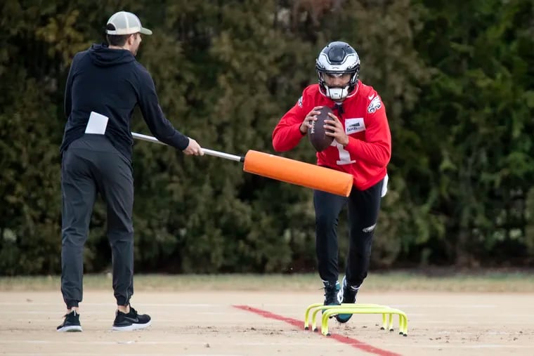 Eagles quarterback Jalen Hurts runs drills during practice Thursday at the NovaCare Complex.